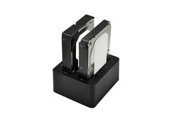 Docking station for hard disk and two hard disk isolated on white background. Included clipping path