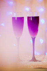 toast of champagne glasses background blurred lights red pink new year