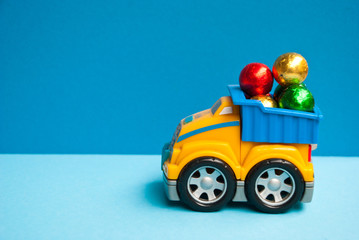 Child car track with christmas candy on blue background. Xmas concept.