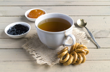 Tea in a white Cup with crackers.