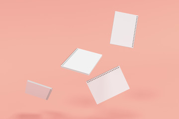 Four notebooks with spiral bound on red background