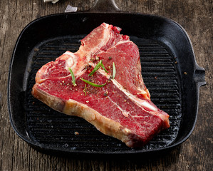 fresh raw T bone steak