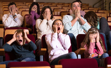 Audience watching movie night for horror