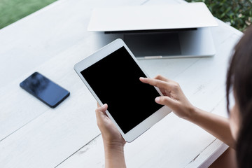 hand holding digital tablet finger point on screen