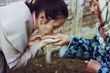 Daughter kisses mom's hands