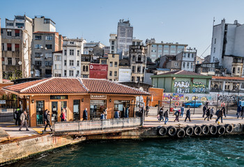 View of historical Karakoy pier for traditional public ferry going Kadikoy,uskudar or Besiktas.ISTANBUL,TURKEY,APRIL 20,2017