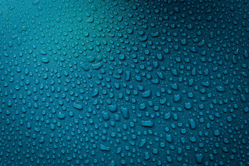 Water Drops On Blue Background.