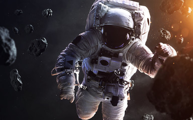 Fototapeta na wymiar Brave astronaut at the spacewalk. People in space. Elements of this image furnished by NASA
