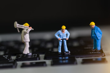 miniature people Work on Computer Keyboard