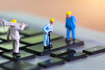 miniature people Work on Computer Keyboard