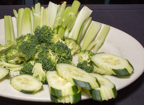 Broccoli Heads, Cucumber Slices and Celery Sticks on a Plate 2