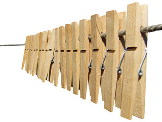a lot of clothes pegs on the rope - isolated