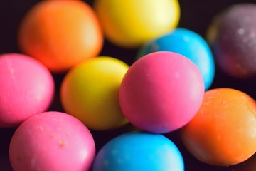 Macro texture of colorful sugar coated candies in horizontal frame