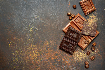 Milk and bitter chocolate with cocoa and coffee beans .Top view with copy space.