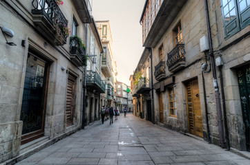 Fototapeta na wymiar People walking in a street in Pontevedra during the Camino de Santiago trip