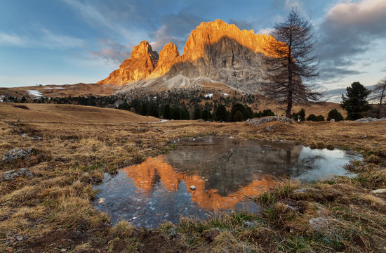 View of Sasso Piatto at dawn - Plattkofel from Passo Sella, part of the Dolomites in South Tyrol, Italy