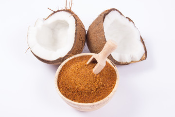 Coconut with coconut sugar isolated on white background.