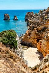 Beach of Lagos, Portugal. Rocks in Sea at Golden Coast Lagos.