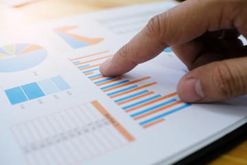 Hands of business people analyzing chart Finance managers task