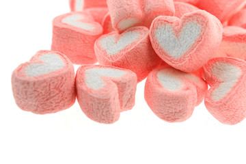 Pink heart shaped marshmallows isolated