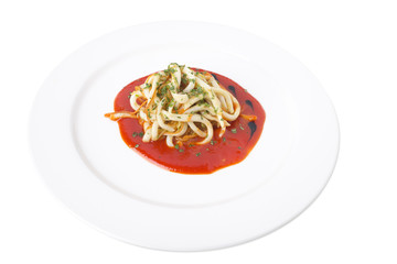 Squid noodles with delicious red sauce.