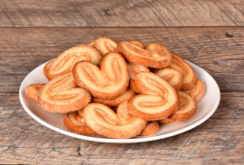 Fresh chips. Biscuits on the table. Crochets on a plate. Baking from flour.