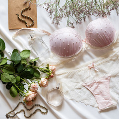 Flat lay background with woman underwear and different accessories on it