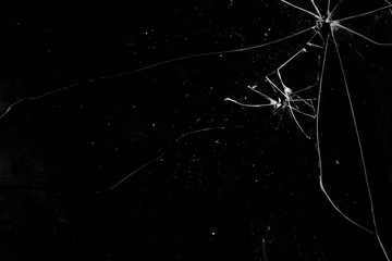 A broken glass on a deep black background. Useful texture for overlay.
