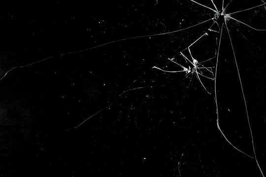 A broken glass on a deep black background. Useful texture for overlay.

