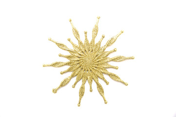 Gold snowflake on a white background close up 