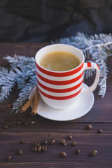 Cup of coffee and christmas fir branch