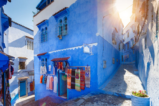Blue building at Chafchuen at sunny day. Traditional Maroccan fabric store. Travel destination concept.