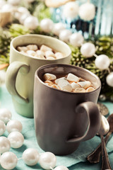 Hot chocolates with marshmallows in Christmas setup