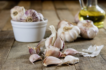 Tasty garlic on a wooden kitchen table. Vegetables in the kitchen atmosphere. Wooden table.