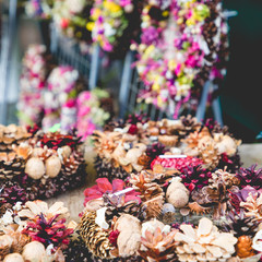 Christmas flowers wreaths decorations in Cracow Christmas market in Poland.