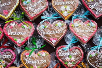 Fototapeta na wymiar Gingerbread Hearts at Polish Christmas Market. Cracow. Xmas market in Poland. On traditional ginger bread cookies written 