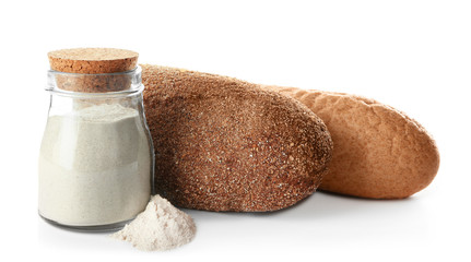 Composition with buckwheat flour and fresh bread on white background