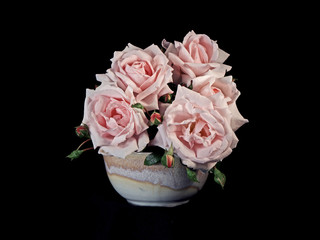 Flower arrangment of pink Roses in a ceramic bowl