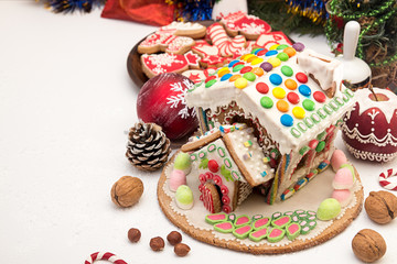 Gingerbread house. Christmas holiday sweets. European Christmas holiday traditions. Christmas gingerbread house and holiday decorations.