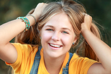 Fototapeta premium Portrait of funny teenager girl outdoors