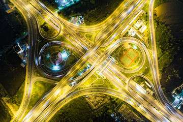 Aerial view light intersection on motorway highway at night