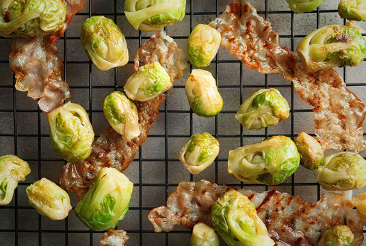 Brussels sprouts with bacon on cooling rack, closeup