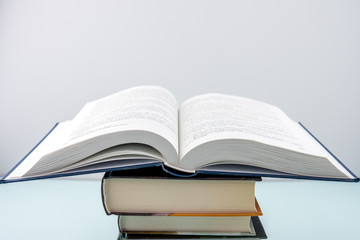 Education concept - books on the gray background 