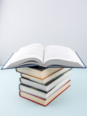 Education concept - books on the gray background 