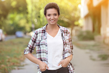 Portrait of beautiful young woman outdoors