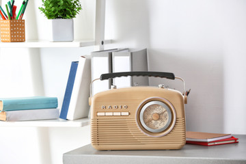Retro radio on table in room
