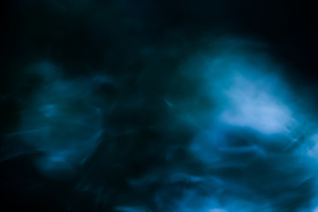 Fluffy Puffs of Smoke and Fog on Black Background