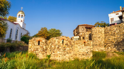 Fototapeta premium City landscape - Orthodox church and ancient ruins in the town of Sozopol on the Black Sea coast in Bulgaria