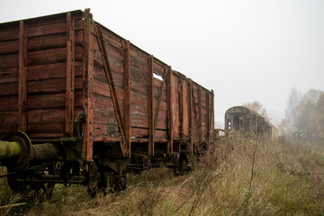 Fototapeta na wymiar Old rusty trains. Old abandoned track, siding with dirty old trains.