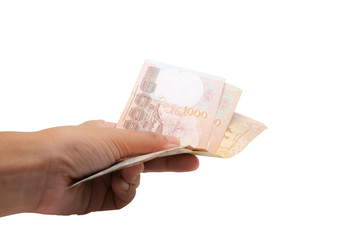 Hand holding Thai currency, 1000 Baht, money banknote of Thailand isolated on white background,...